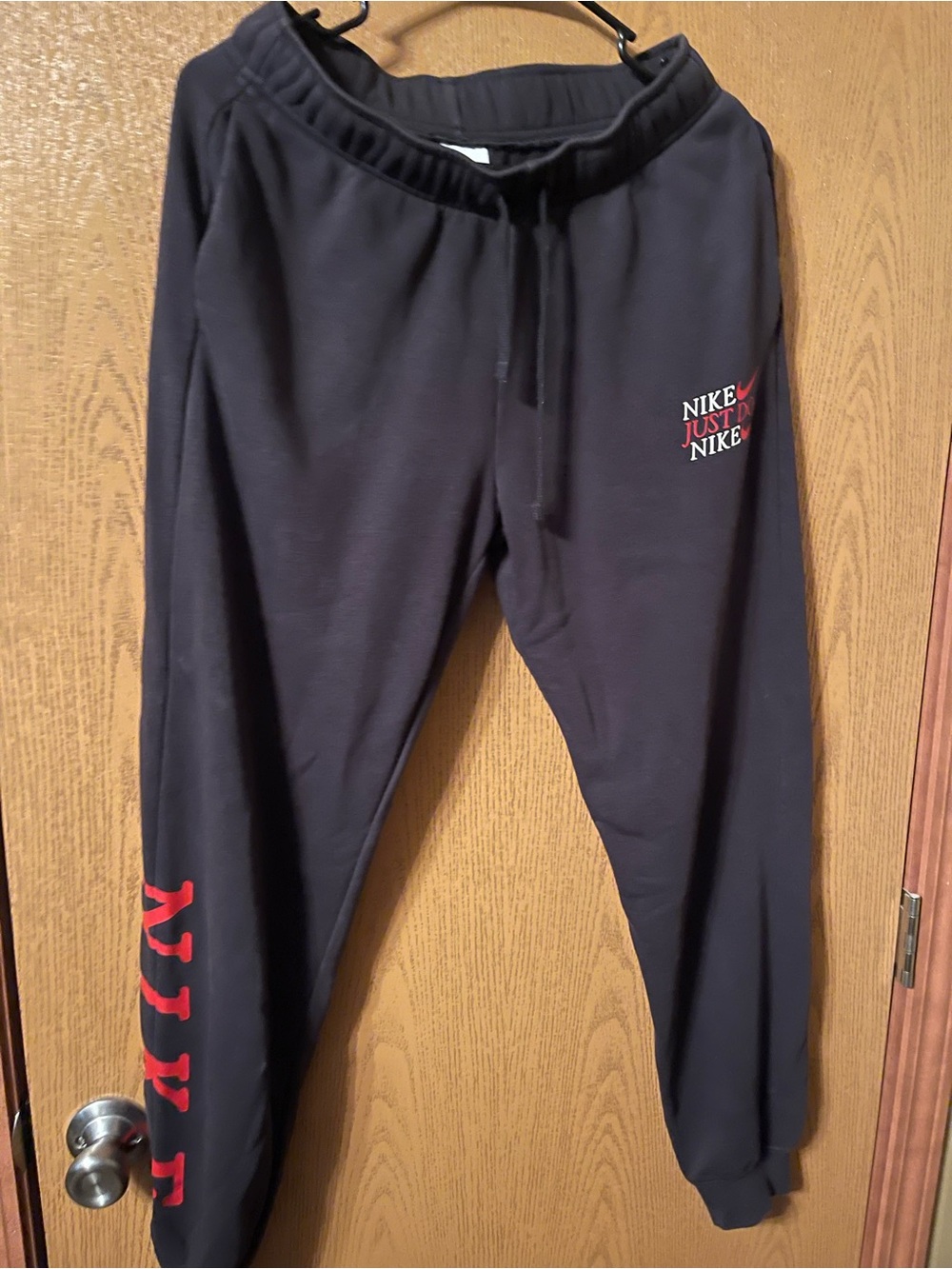 Nike Black Sweatpants with Red Logo Accents